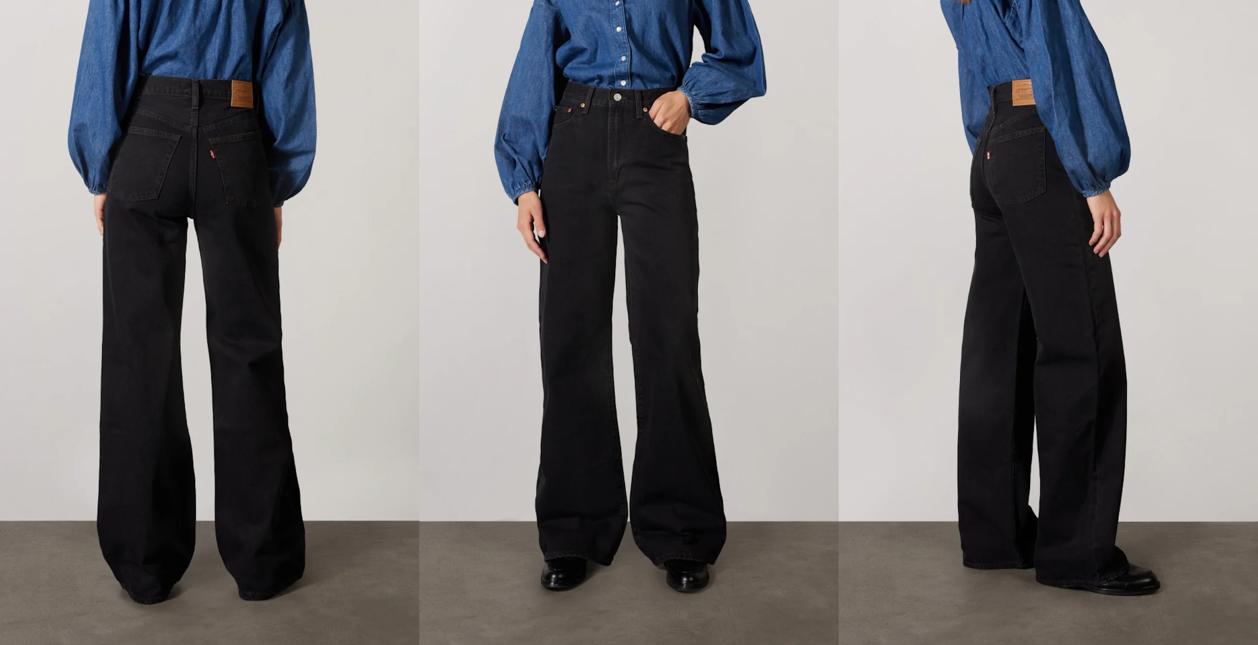Fram-, bak- och sidovy av en modell som bär högmidjade svarta vida jeans och en blå jeansskjorta, stående på ett grått golv.